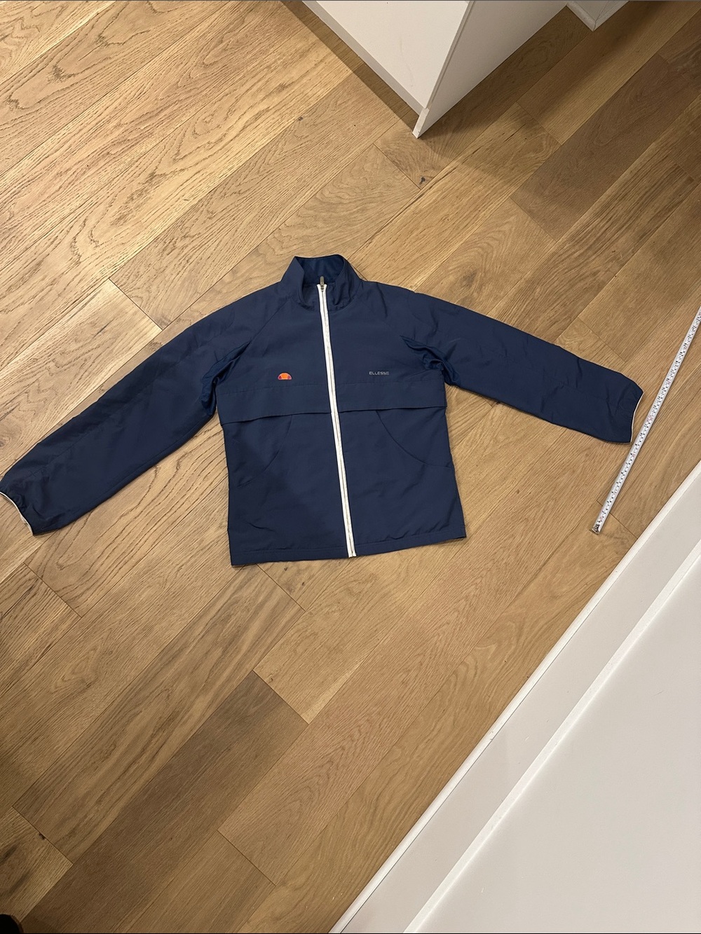 Ellesse Navy Jacket with White Zip and Orange Logo